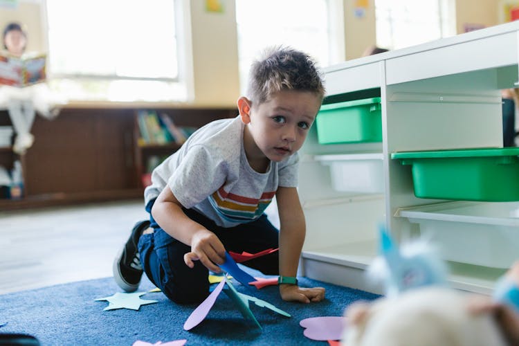 Boy Playing With A Toy 