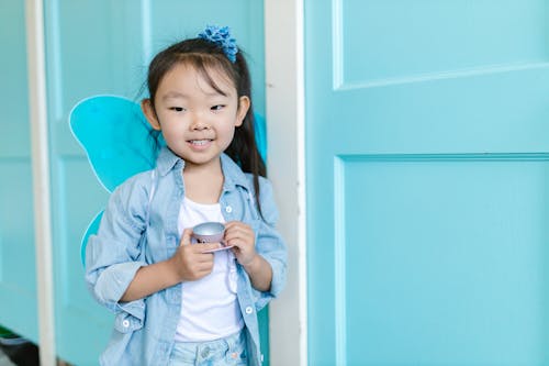 Cute Girl Holding a Teacup