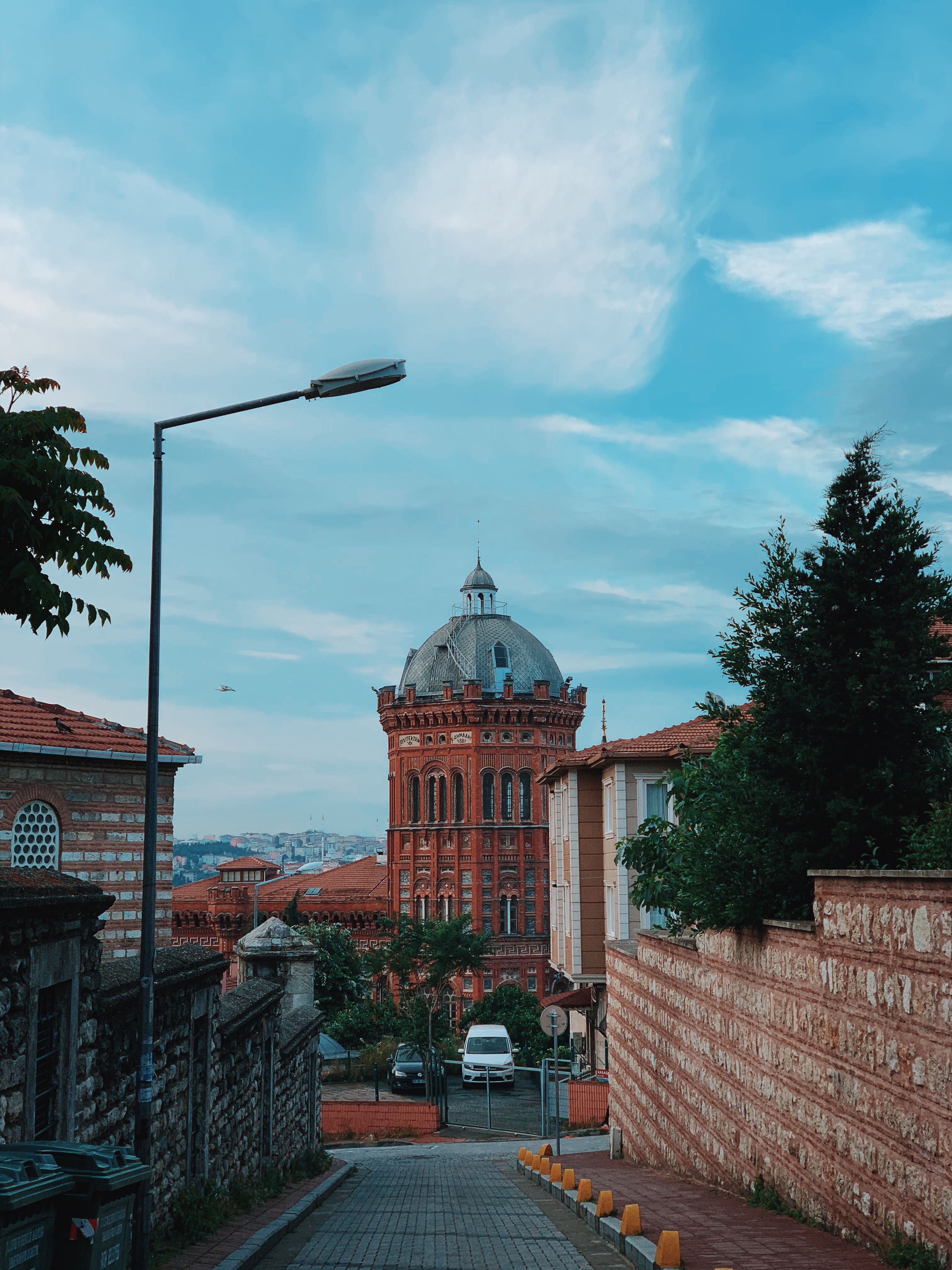 A captivating view of historic building architecture in Fatih, Istanbul under a clear blue sky.