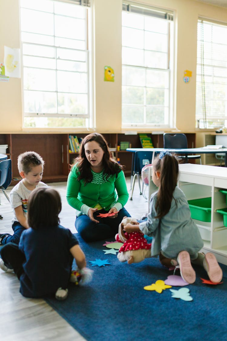 Teacher Talking To Kids In School