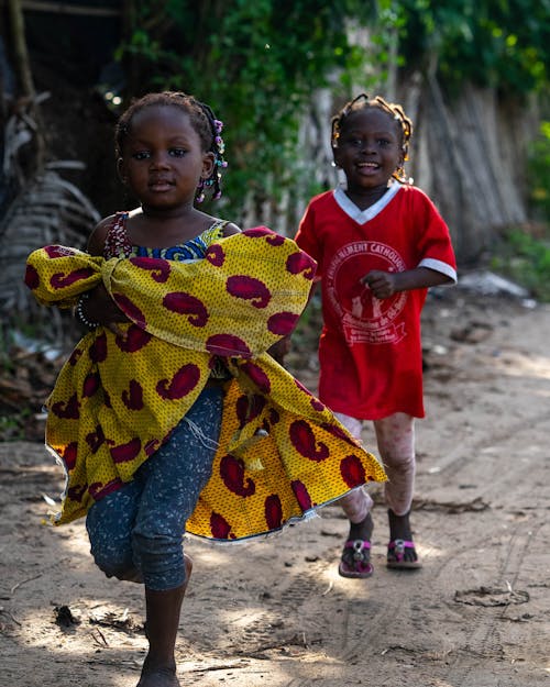 Kids Standing on Dirt Road