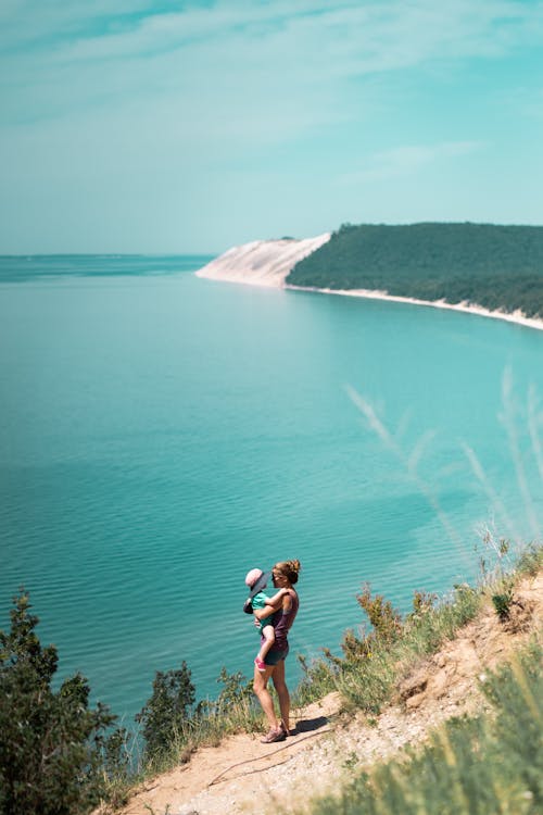 Mother and Daughter Standing Near Ocean