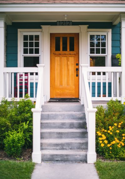 House entrance framed by shrubs — photo by Brett Sayles on Pexels