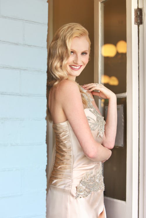 Woman in White Floral Lace Sleeveless Gown