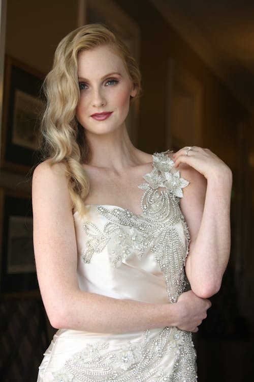 Woman in White Floral Lace Sleeveless Dress