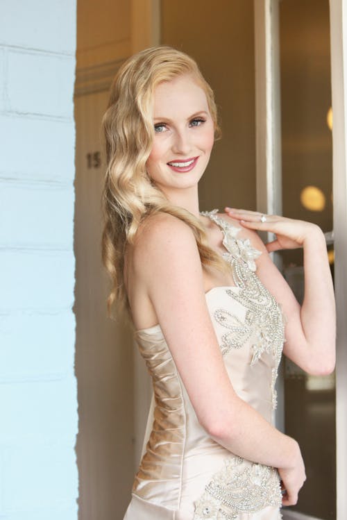 A Woman in Gold Floral Gown