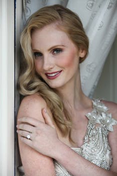 Beautiful woman posing indoors with delicate and elegant attire, exuding charm and grace.