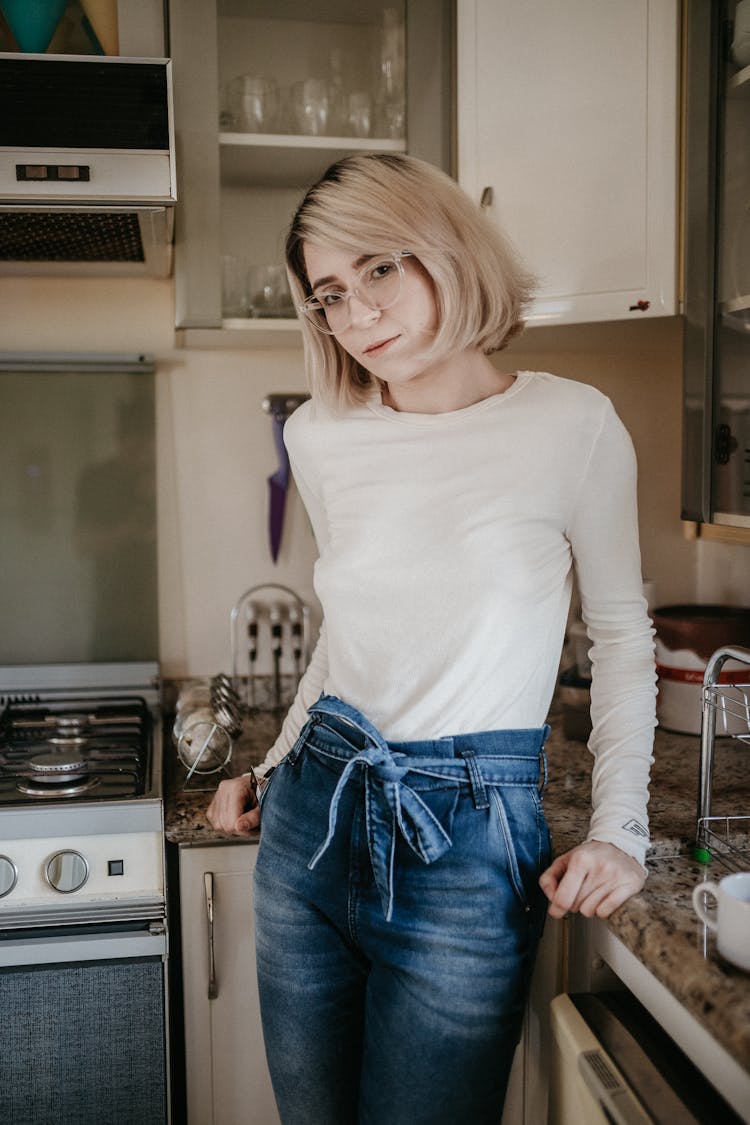 Woman Leaning On Kitchen Counter