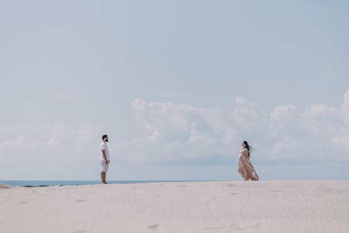 Two People Standing on the Shore