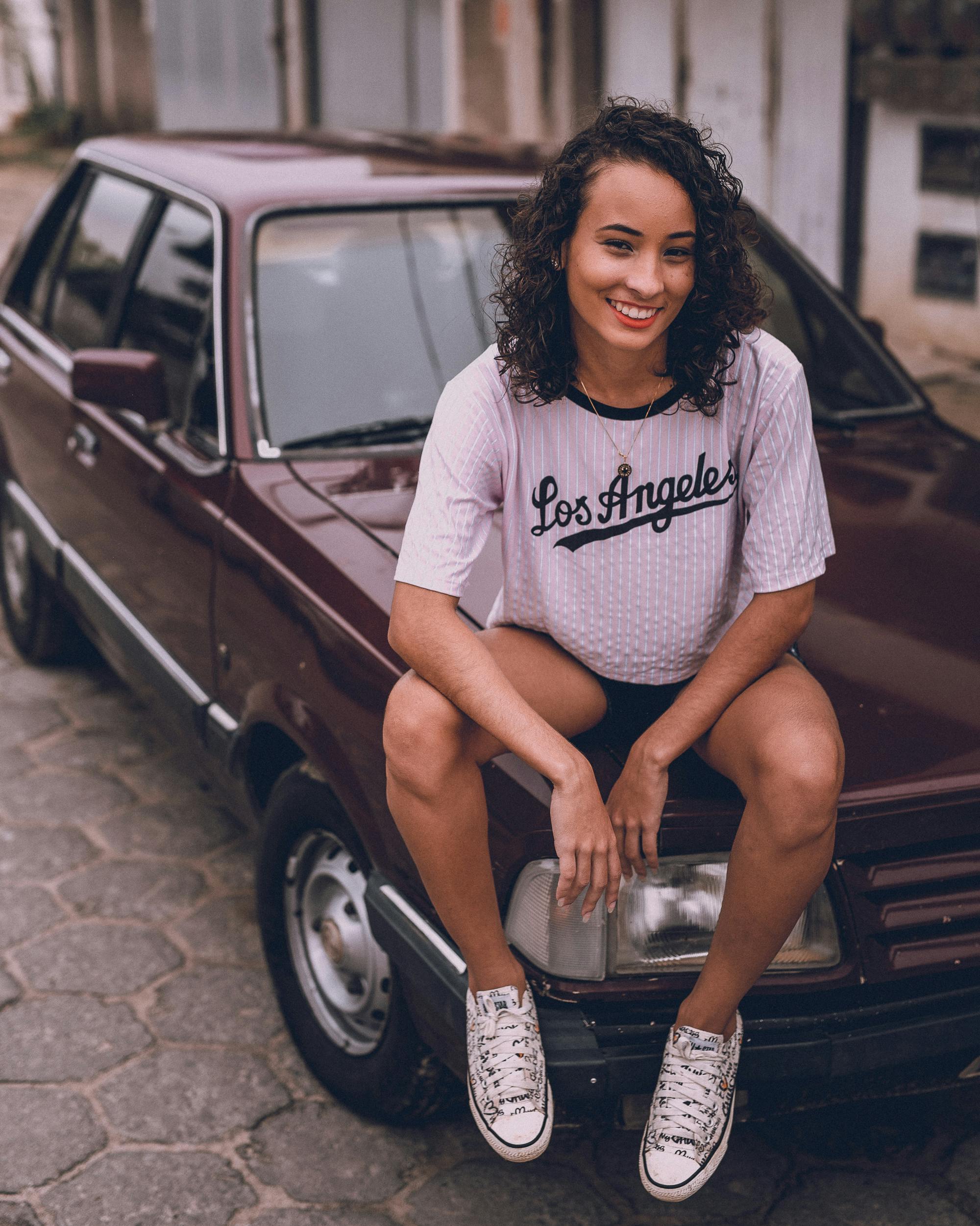 woman sitting on the car