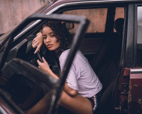 Girl Sitting in a Car 