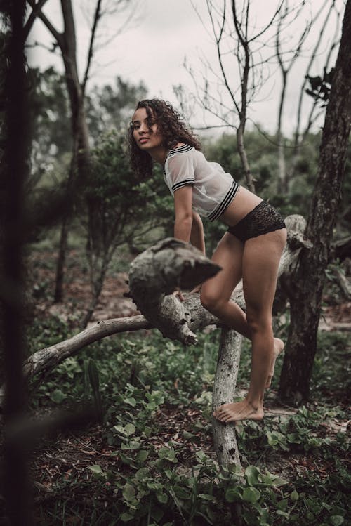 Woman Wearing Underwear in a Forest 