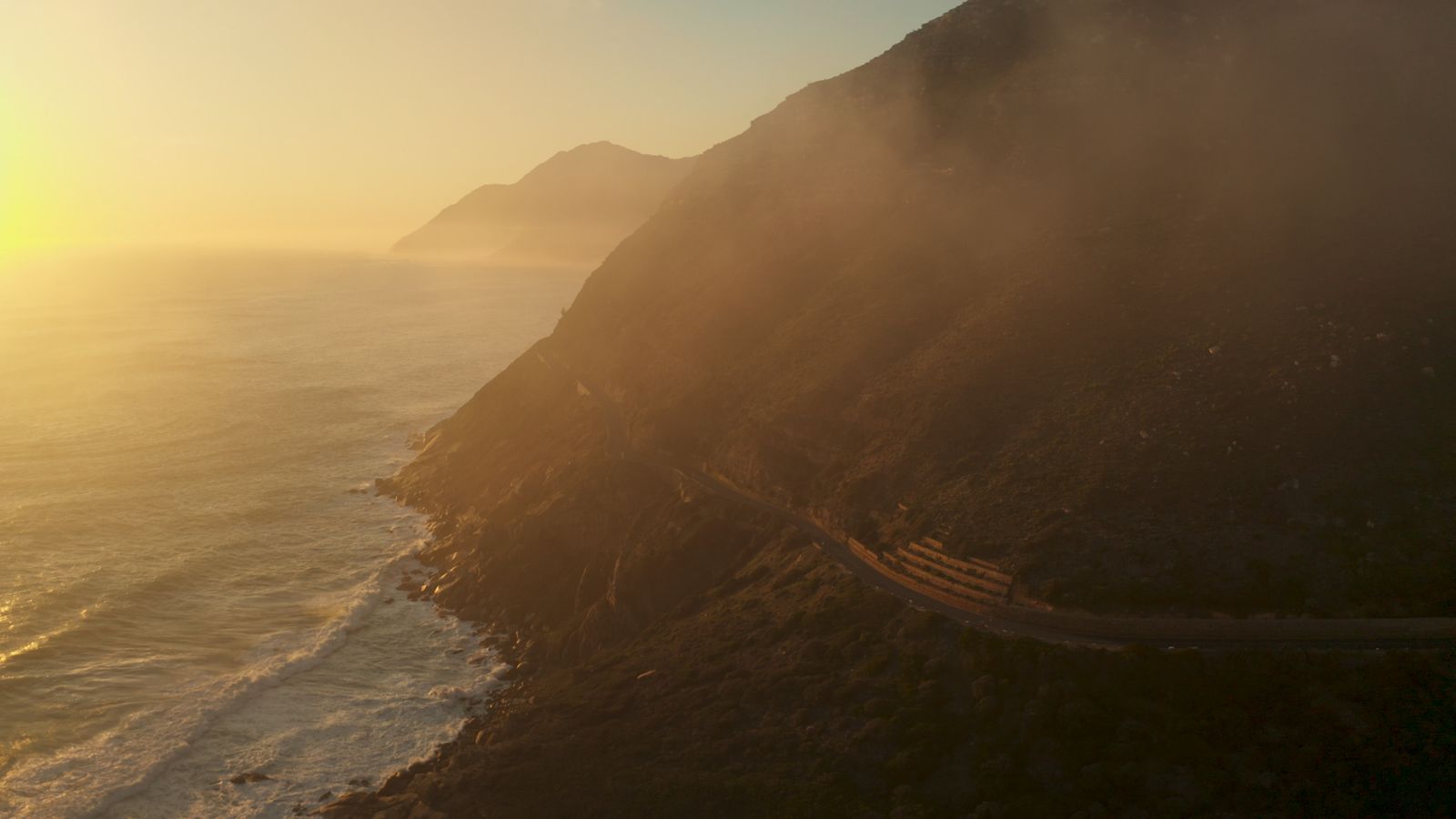 Aerial view of coastal mountains wrapped in fog — Taryn Elliott on Pexels