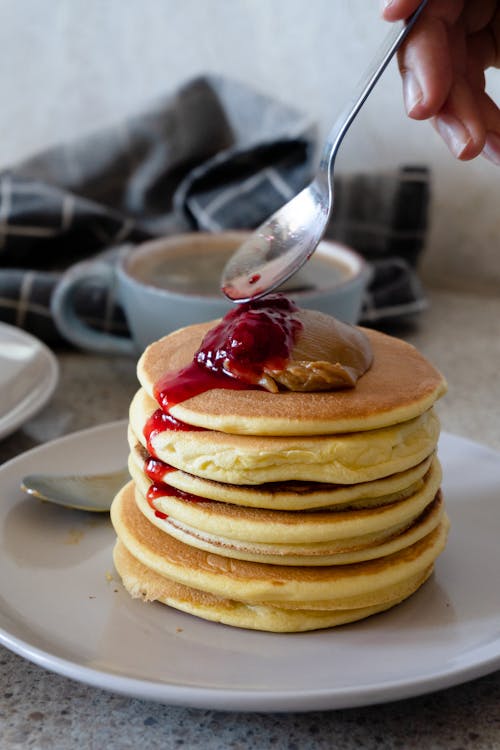 Free Pancakes With Strawberry Syrup on Top Stock Photo