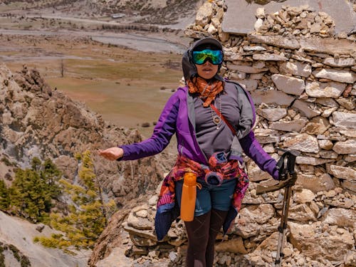 Woman in Purple Jacket and Blue Shorts Hiking