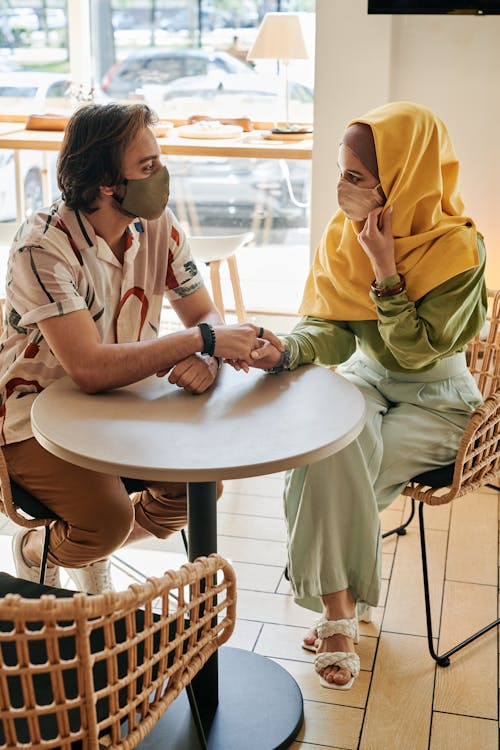 Couple Wearing Face Masks Having a Date