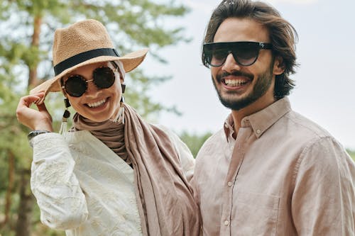Couple Wearing Sunglasses Smiling