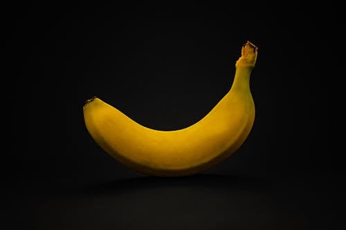 Yellow Banana on Black Surface