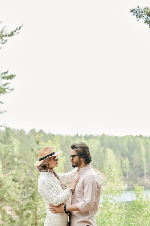 Bearded Man Standing in Front of a Woman