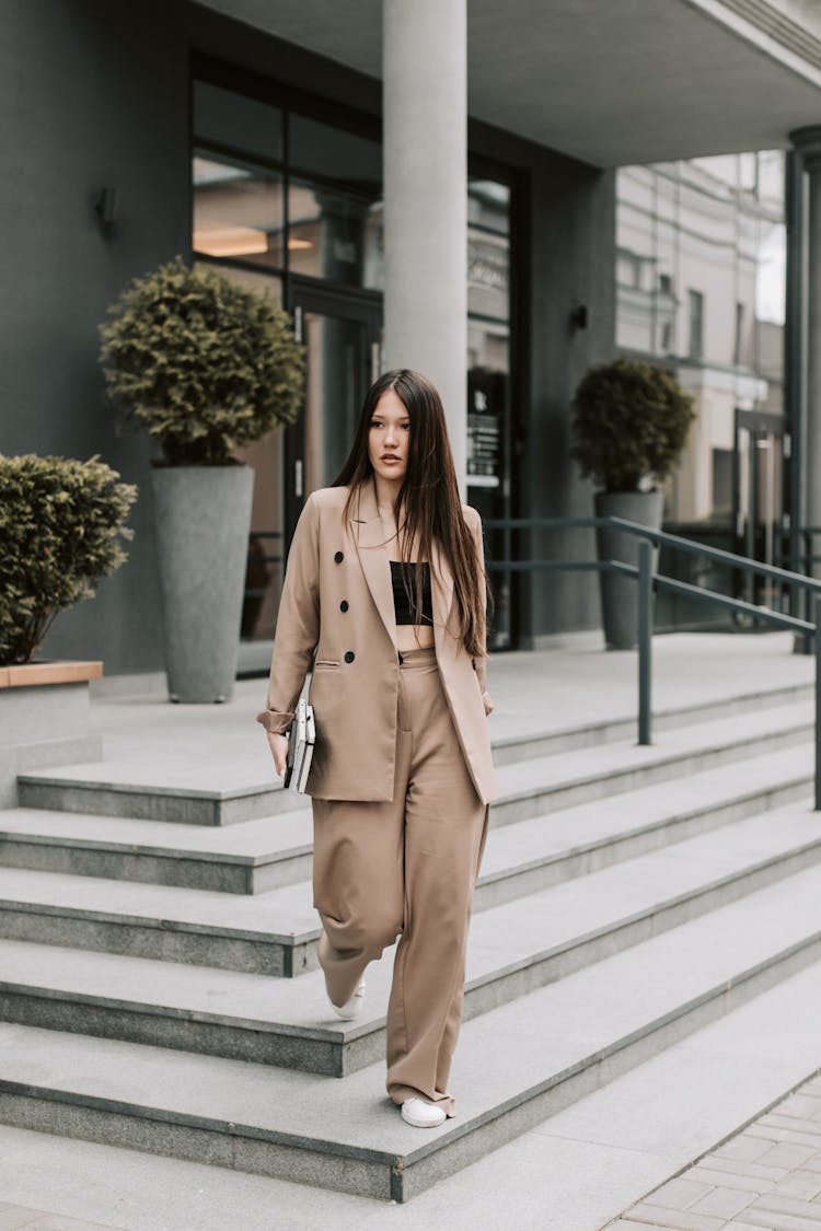 A Woman In A Beige Suit