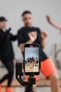 Man in Black Crew Neck T-shirt Holding Silver Iphone 6