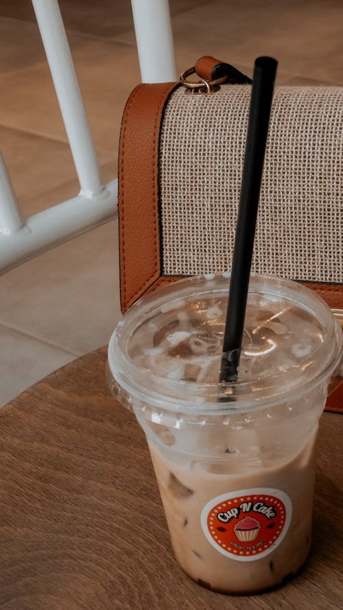 Cold Drink in a Clear Plastic Cup With Black Straw