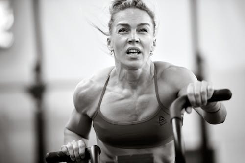 Free A Grayscale Photo of a Woman Exercising Stock Photo
