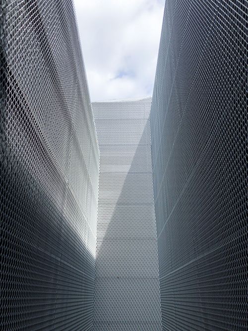 Free Modern vertical shot of geometric steel architecture with an abstract pattern and futuristic design. Stock Photo