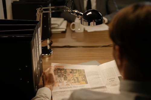 A Person Reading a Newspaper