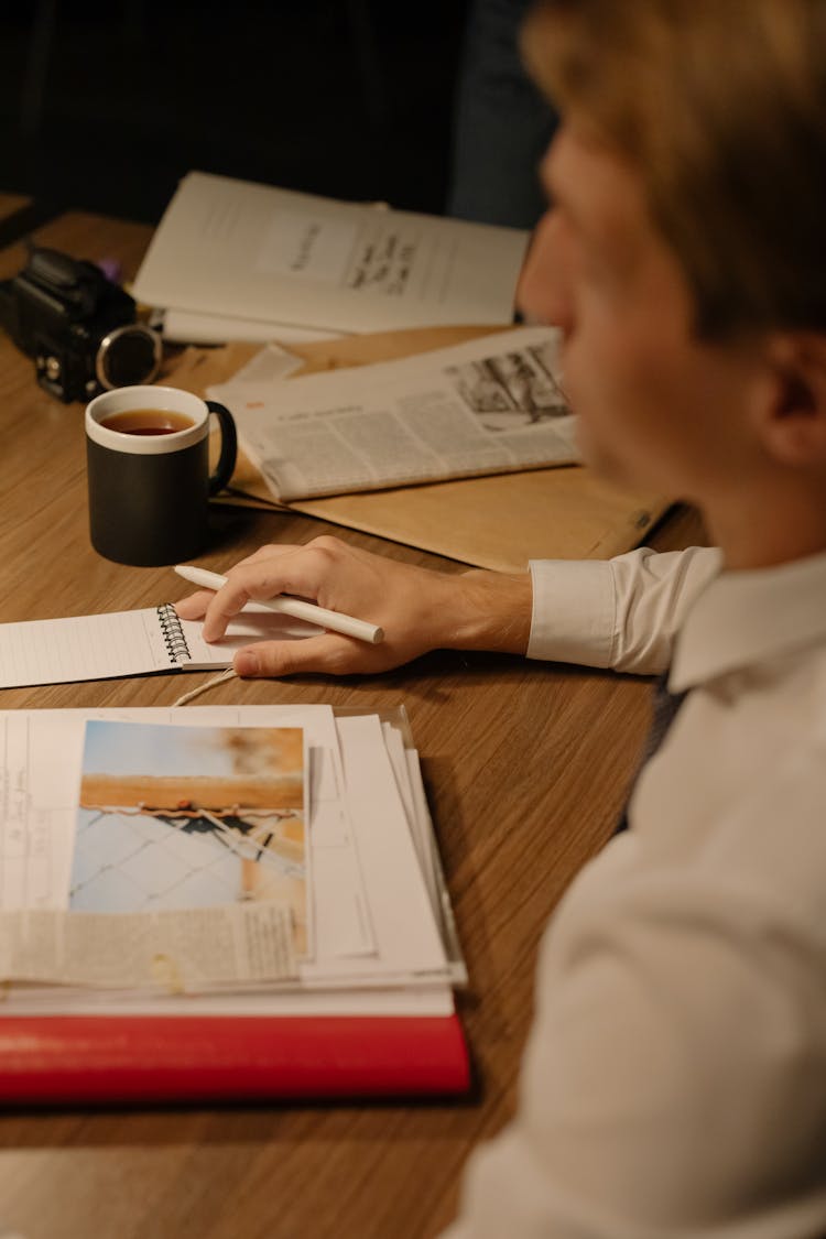 A Man Sitting At The Table