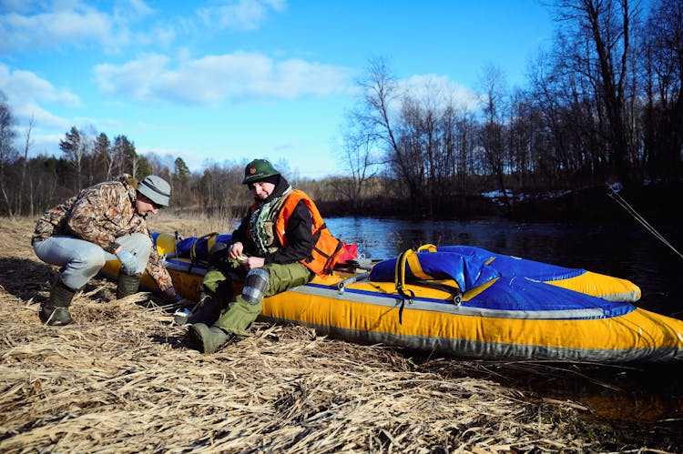 Two Men With An Inflatable Raft 