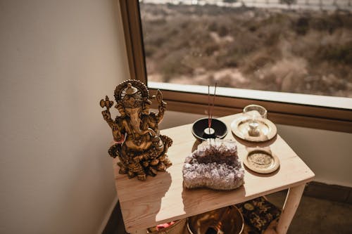 Ganesha Figurine Beside the Incense Sticks