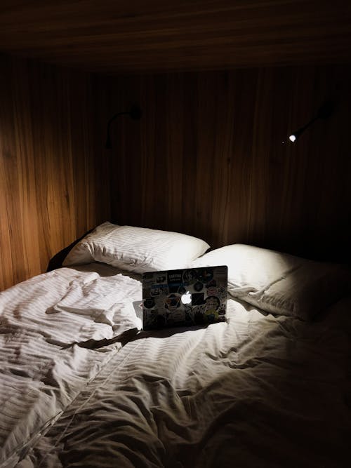 Macbook on a Bed