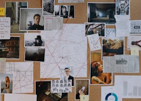 A detailed crime investigation board filled with photos, maps, and red strings connecting clues and evidence.