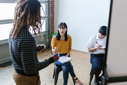 Woman Sitting on a Chair While Talking