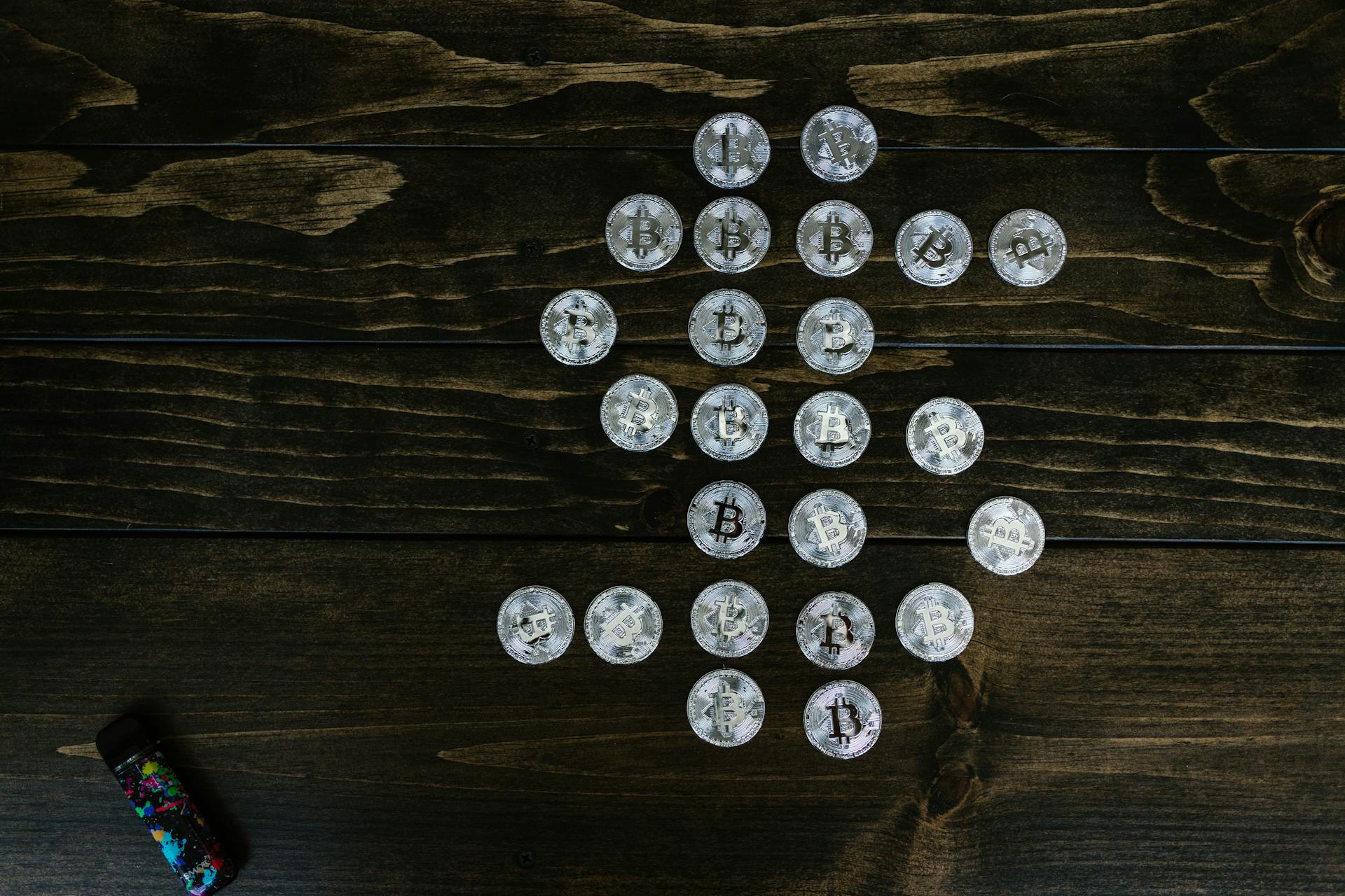 Flat Lay Photography of Bitcoins on Wooden Surface