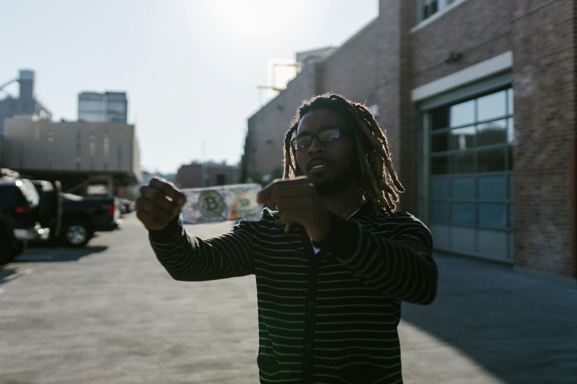 Man Holding a Banknote