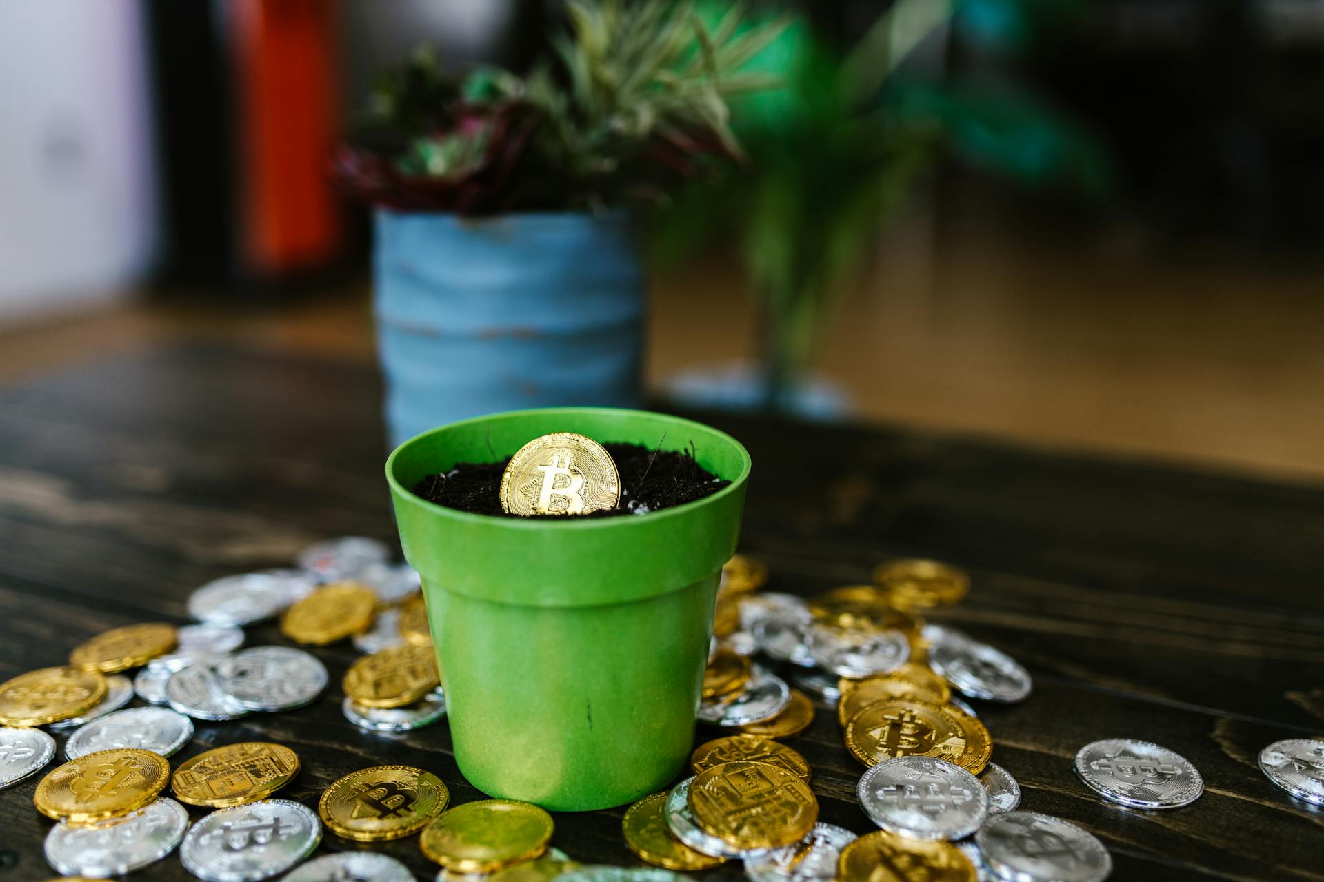 A Pot with Gold Coin on a Wooden Surface