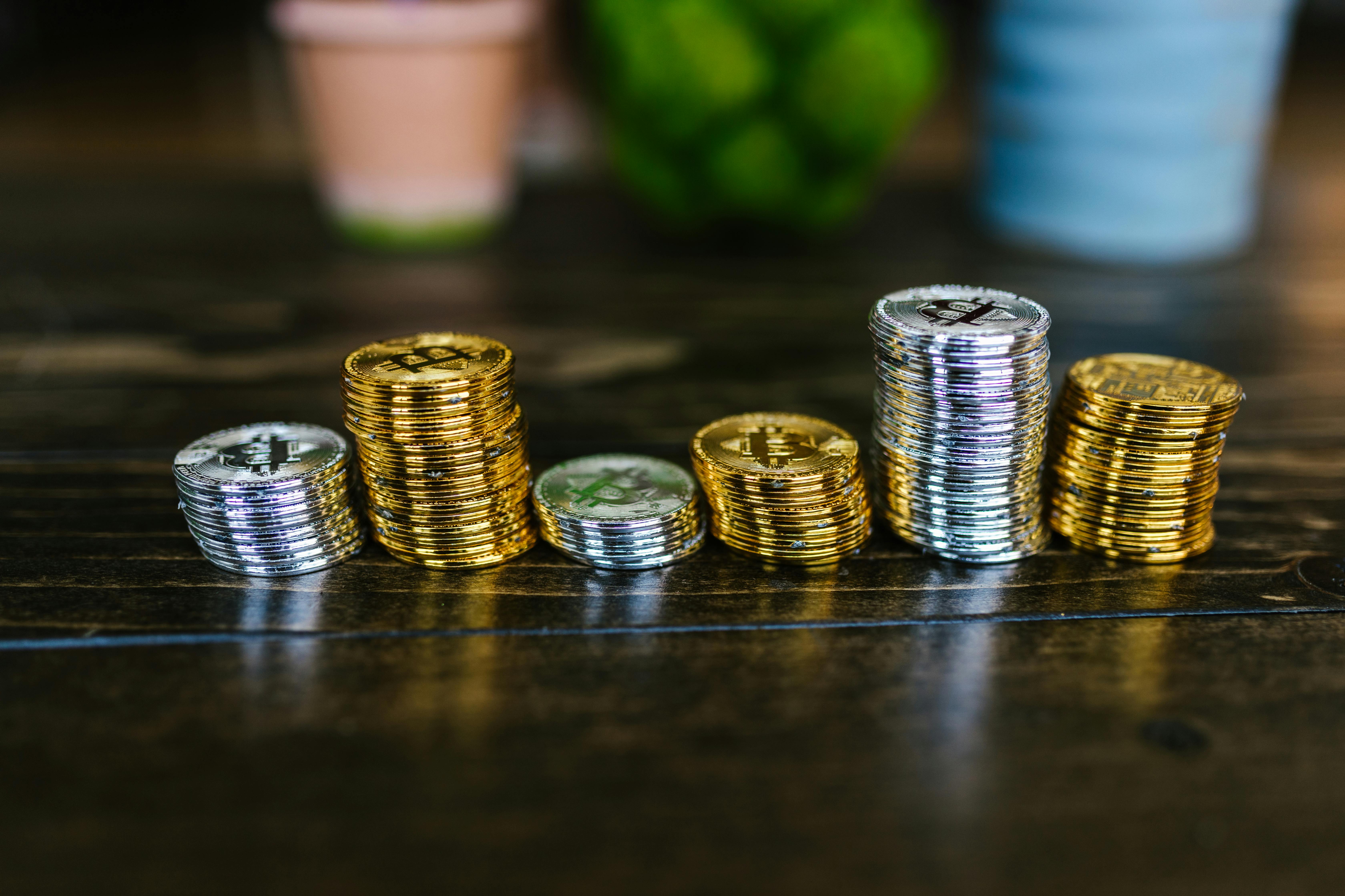 Silver and Gold Coins on Black Table · Free Stock Photo