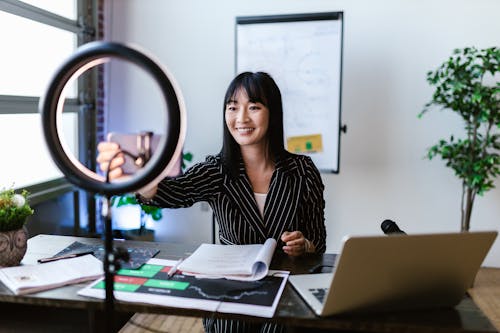 A Woman Vlogging Inside the Office