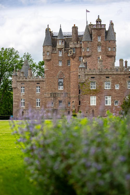 Free Glamis Castle in a Grassland  Stock Photo