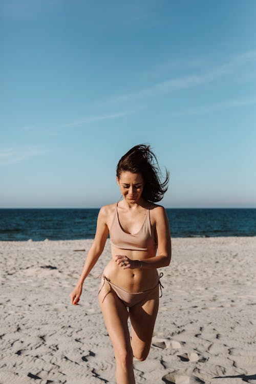 Woman Running at the Beach