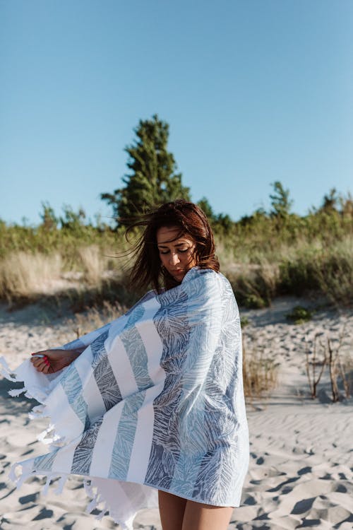 Woman wrapped in a Picnic Blanket 