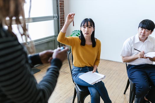 Team engaged in lively discussion during a business meeting in a modern office setting.
