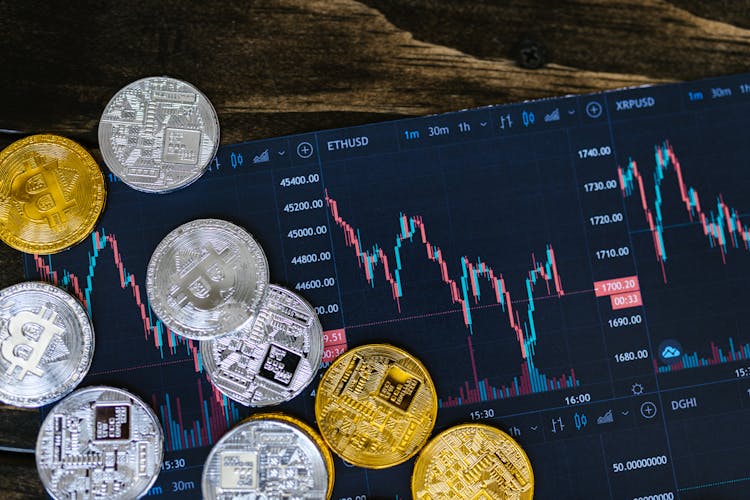 Close-Up Shot Of Silver And Gold Round Coins