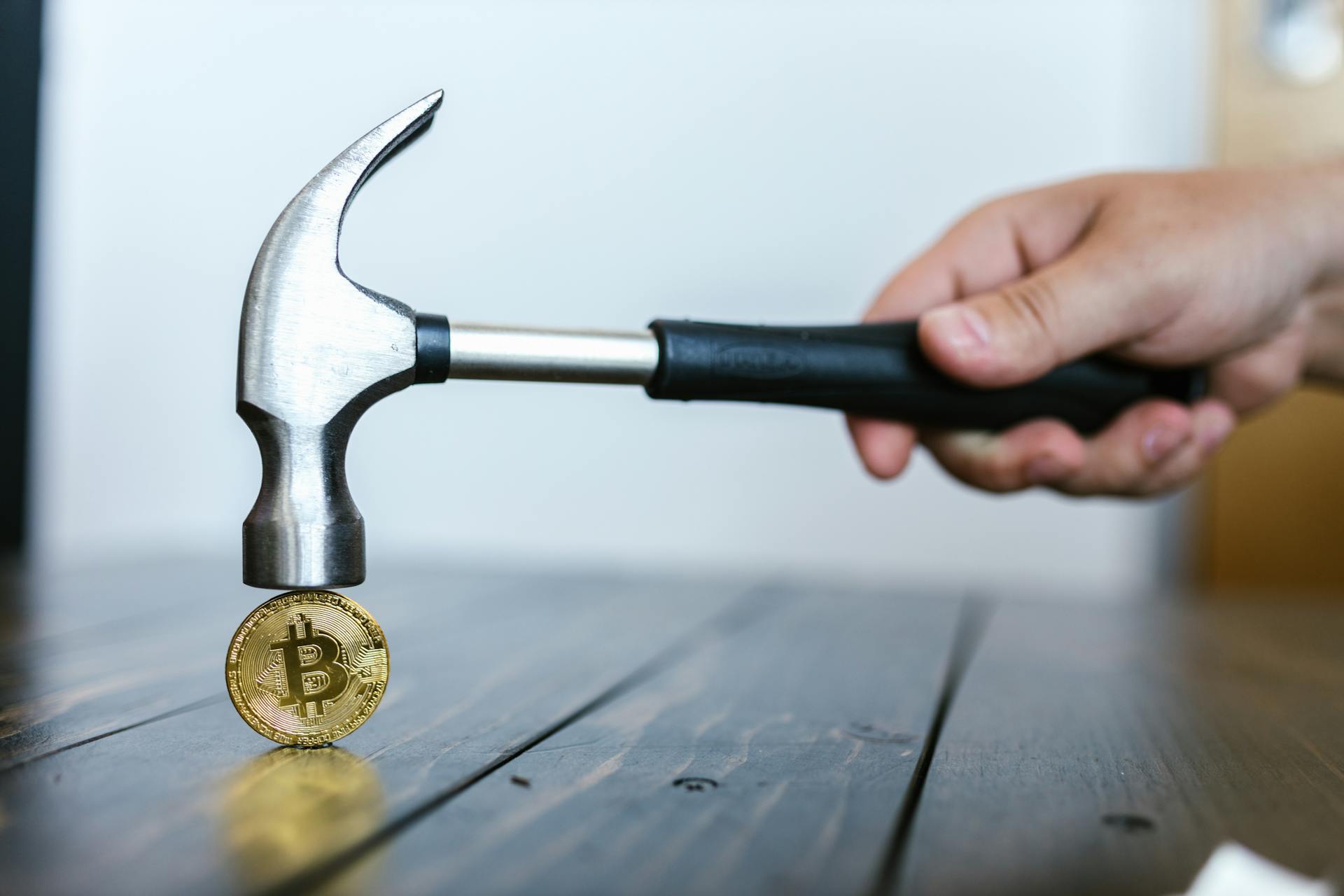 Person Hammering the Bitcoin