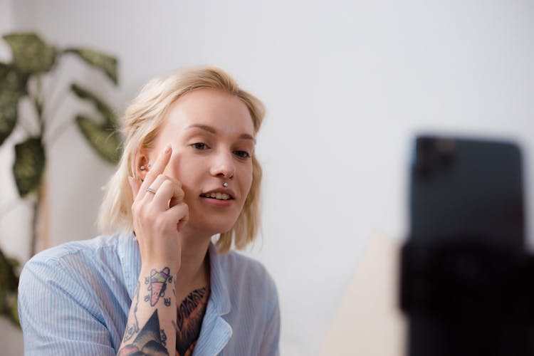 A Woman Vlogging While Applying Makeup