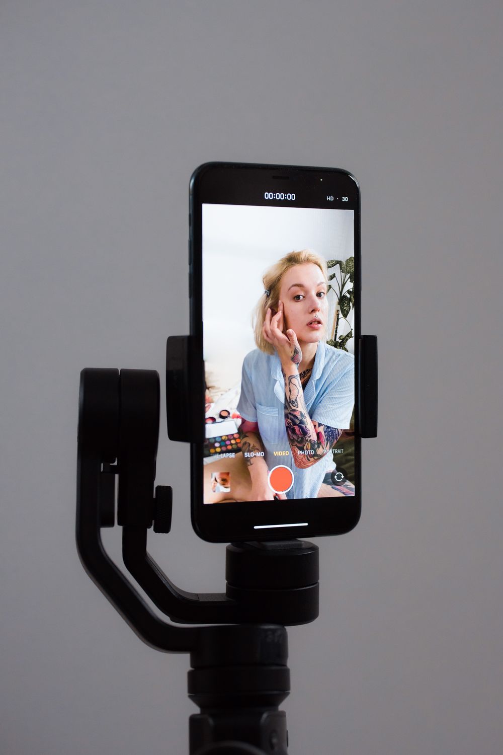 Creator filming beauty content with a smartphone