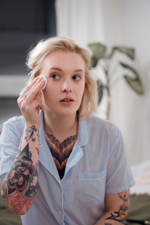 Free Woman doing a Skincare Routine on her Face  Stock Photo