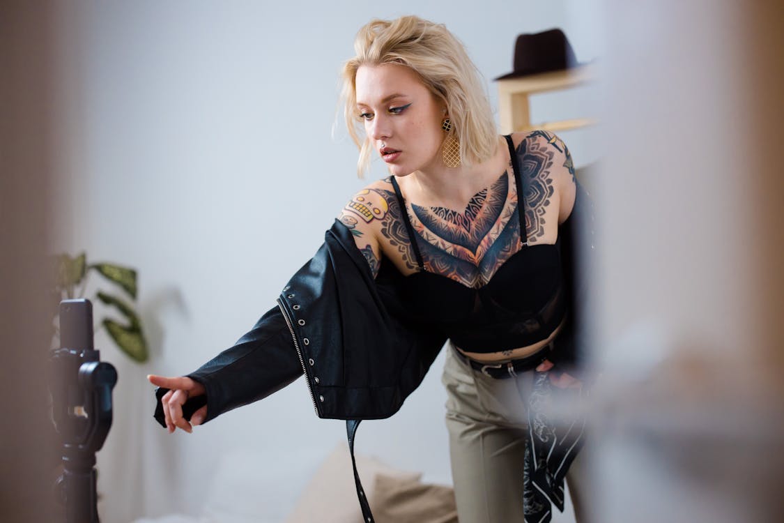 Woman in Black and White Long Sleeve Shirt and Black Pants